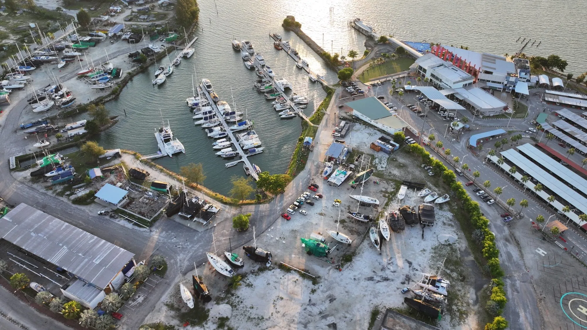 Aerial view of MI Pangkor Marina and boatyard at golden hour