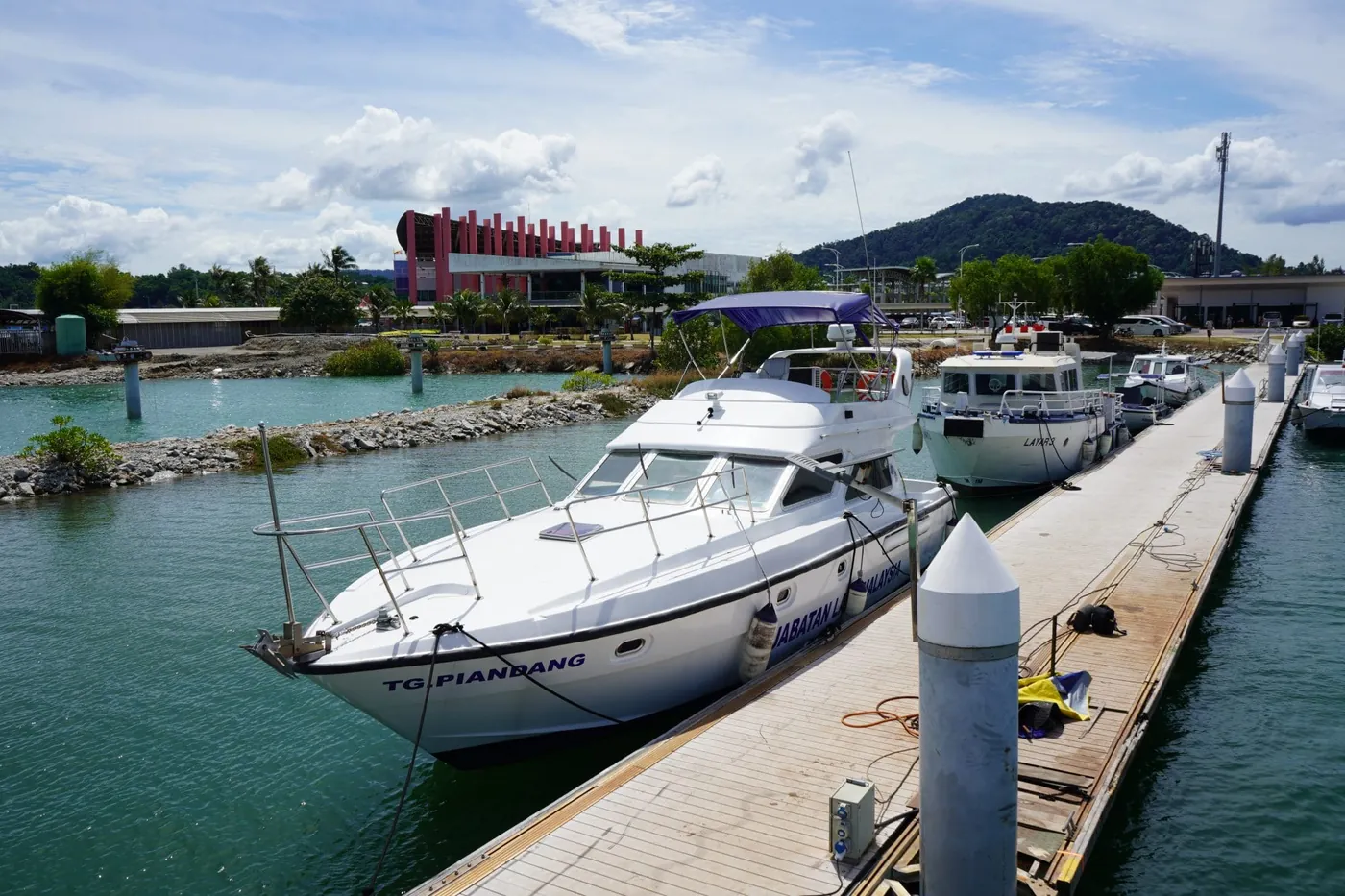 Motor yacht moored along a pontoon at MI Pangkor Marina